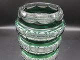 a glass vase that is sitting on a table