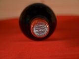 a bottle of wine that is sitting on a table