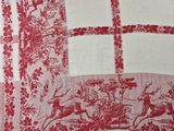 an image of a red and white table cloth with deers and flowers