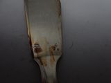 an old spatula that has been rusted and rusted