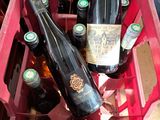 many bottles of wine in a pink crate