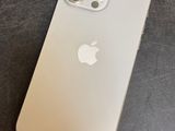 a close up of a white iphone sitting on top of a table