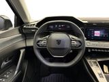the interior of a car with a steering wheel and dashboard controls