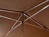 a brown umbrella that is open on a sunny day