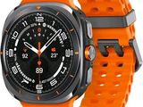 an orange watch with a black face on a white background