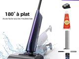 an image of a vacuum cleaner with a bottle of cleaner next to it