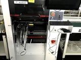 an image of a machine in a factory with a keyboard and monitor