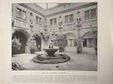 an old photo of a courtyard with a fountain in the middle of it
