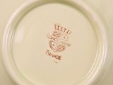 a white plate with a brown design on it