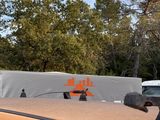 a skateboard on top of the roof of a car