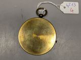 an image of a gold plated clock hanging on a wall