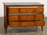 an image of a wooden chest of drawers with marble top