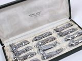 a box with six different types of silverware in it