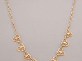 a gold plated necklace with circular medallions on a chain