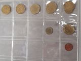 a lot of coins that are in a clear box
