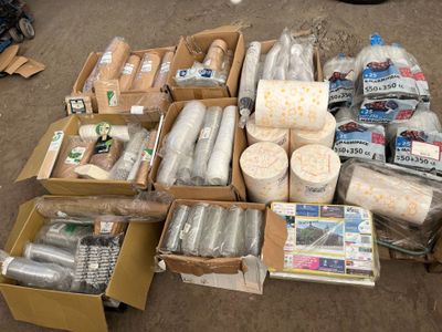 a lot of items that are in boxes on the ground