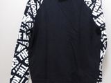 a black and white sweatshirt with white letters on it