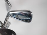 a close up of a golf iron and a golf club