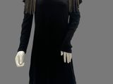 an image of a mannequin wearing a black dress with fringes