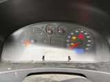 a close up of a car dashboard with a speedometer