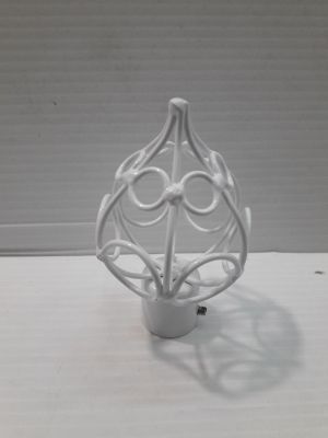 a white vase that is sitting on a table