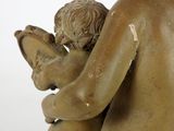 statue of a woman holding a child on her lap