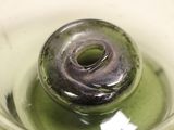 an image of a glass with a donut inside of it