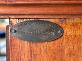 a close up of a plaque on a wooden door