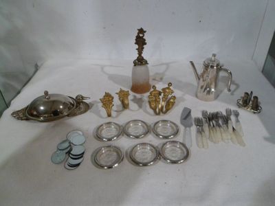 a lot of silver and silverware on a table