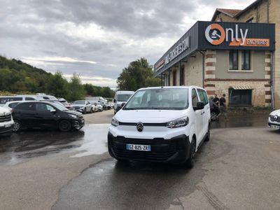 a white van parked in front of a building with a sign that says only