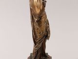 an image of a bronze statue of a woman with a veil on her head