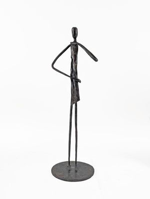 statue of a man holding a knife in his hand on a white background