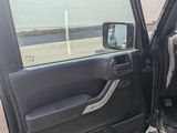 a car that has its door open and is parked in the parking lot