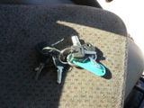 a bunch of keys sitting on the seat of a car
