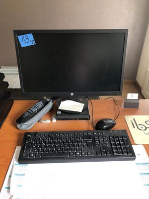 a desk with a keyboard, mouse, and monitor on it