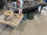 a table that has tools on it in a garage