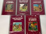 six bandes dessinées françaises pour enfants posées sur une surface blanche