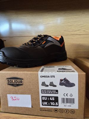a pair of shoes that are on top of a box