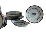 many plates and bowls that are sitting on a table