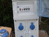 a machine that is sitting on the ground next to a box