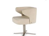 beige upholstered swivel chair with metal base and foot rest