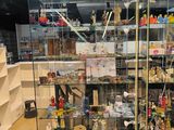 a glass display case with many different items in it