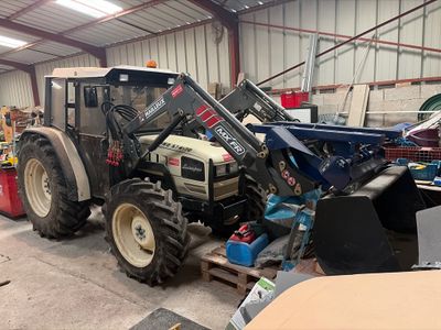 a tractor that is parked inside of a building