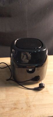 a toaster that is sitting on a wooden table