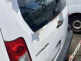 a white van that is parked on the side of the road