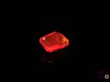 an image of a red diamond on a black surface