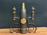 a wine bottle shaped like a wine holder on a table