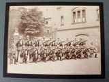an old photo of a group of soldiers posing for a picture