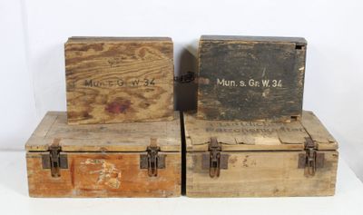 two old wooden boxes sitting on top of each other on a white surface