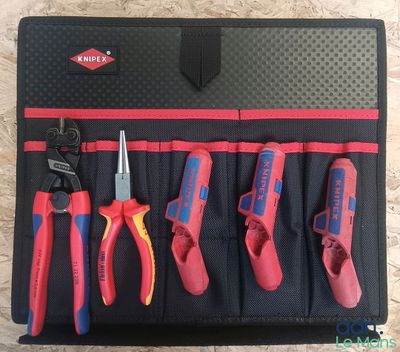 a close up of a tool roll with various tools in it